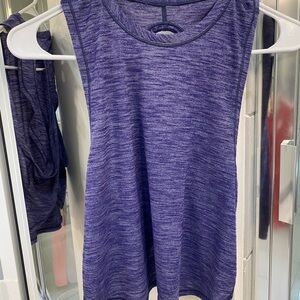 Size 4 lululemon cropped X back tank blue. Loose, long front, short back